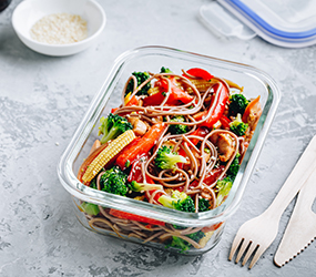 Chicken teriyaki stir fry meal prep lunch box containers with broccoli, carrots, rice or soba noodles